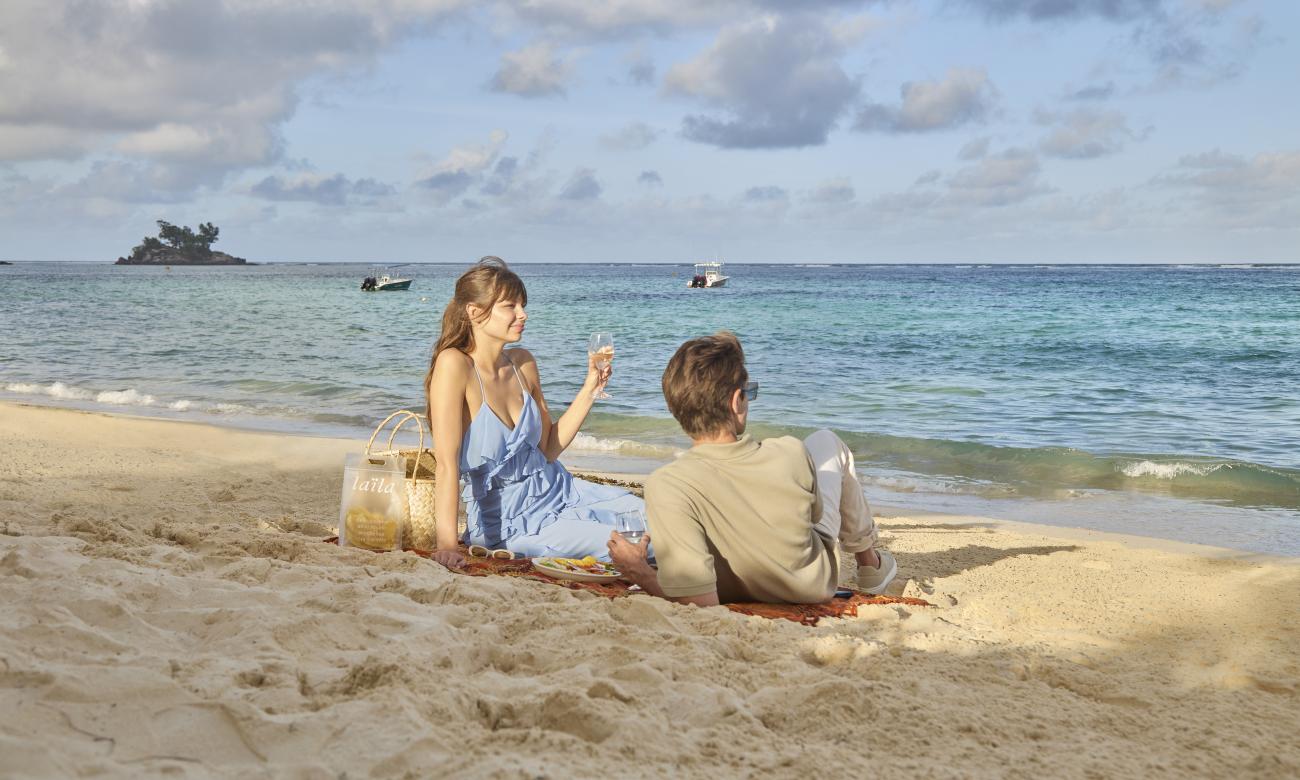 Couple enjoying a picnic on the beach