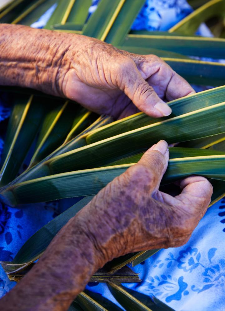 Artisan Hands working with coconut leaves